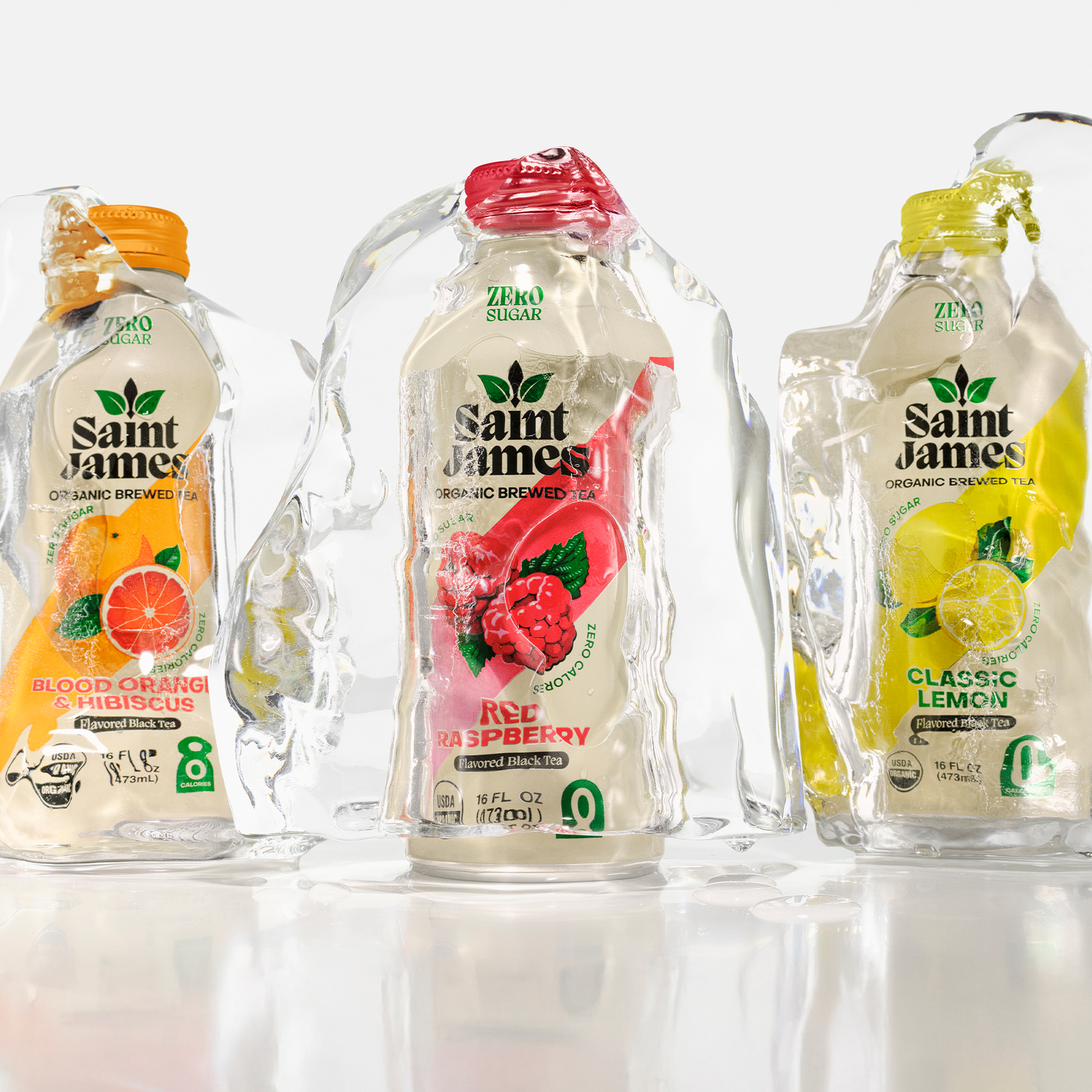 Green vs black tea comparison photo showing Saint James bottles in ice for a clean label iced tea alternative